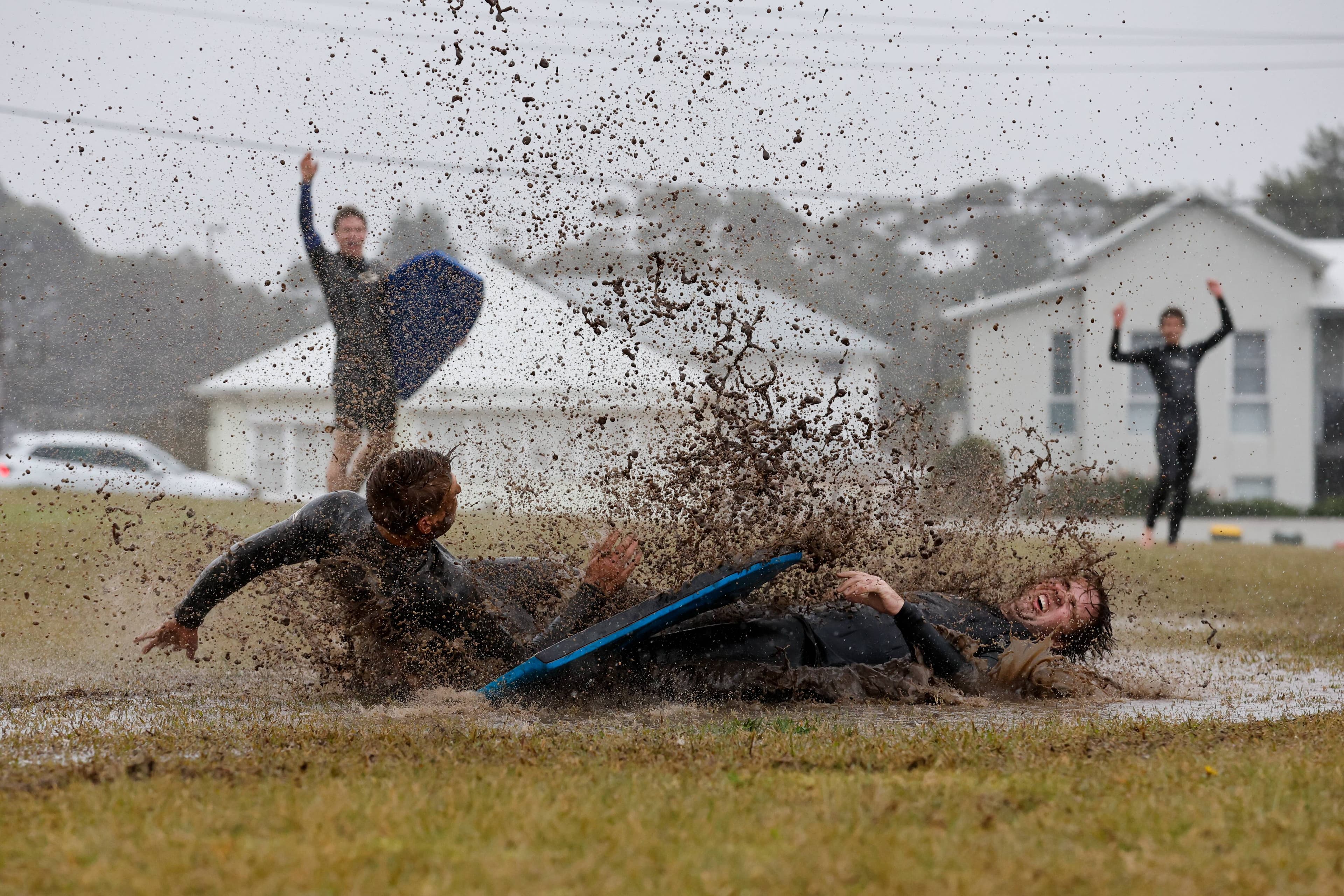 Bulli and Woonona locals making the most of the relentless rain with some "surfing" at Bulli Park. Wade Bissett on the left and Cody Hennessy on the right. Photo taken Thursday August 21, 2025 at Bulli Park. Picture by Anna Warr