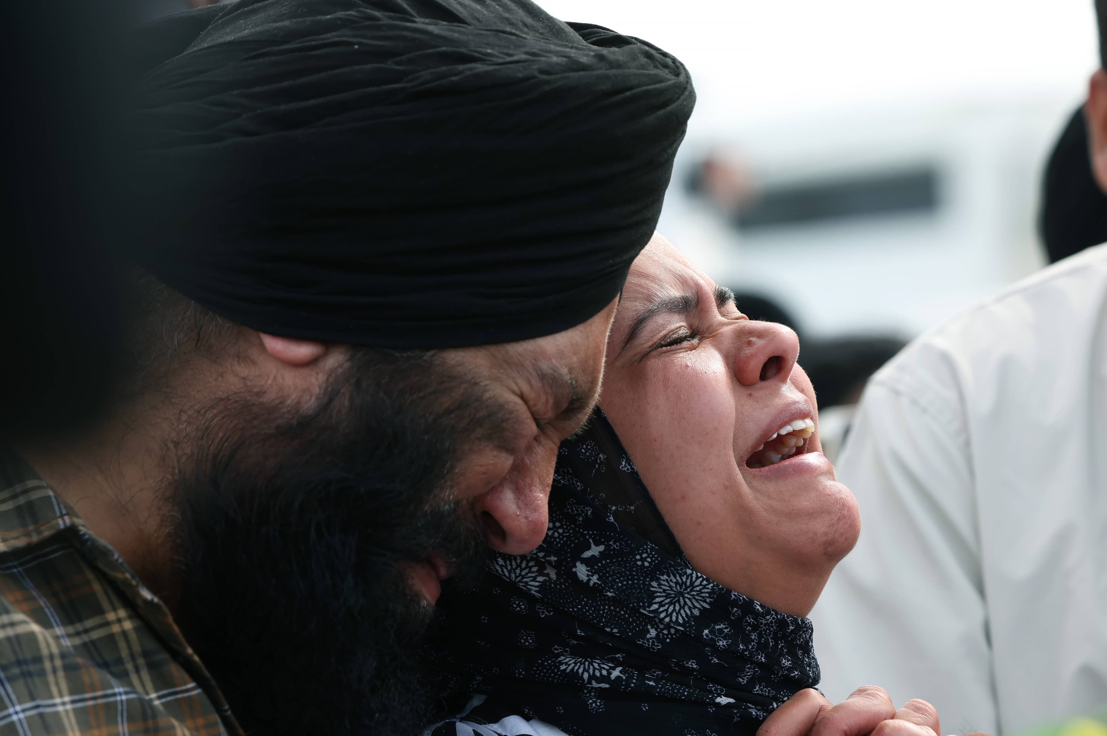 Ekampreet Singh Sahni's mother, Jasmeen, and father, Amrinder, mourn the loss of their son after he was shot at Bar Beach. Picture by Peter Lorimer