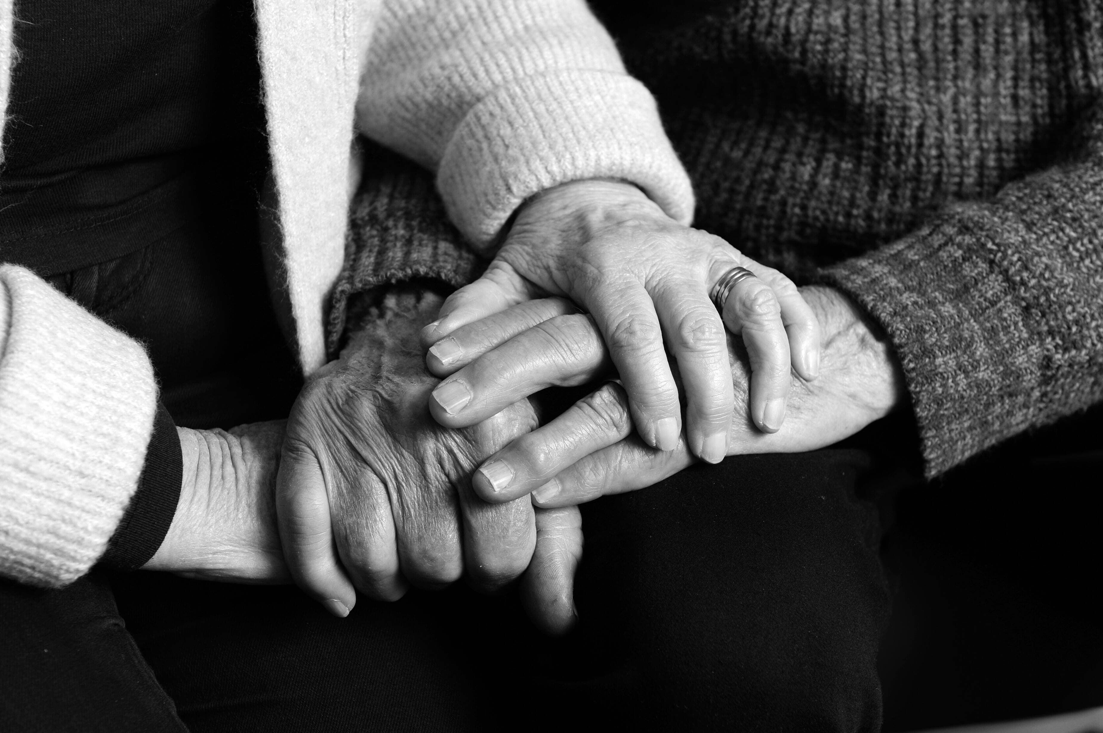 Parents hands, their daughter was a victim of a former Ballarat primary school teacher who sexually assaulted multiple young girls in the school's photography darkroom has been sentenced in the Ballarat County Court after pleading guilty to nine counts of historic indecent assault. Picture by Kate Healy