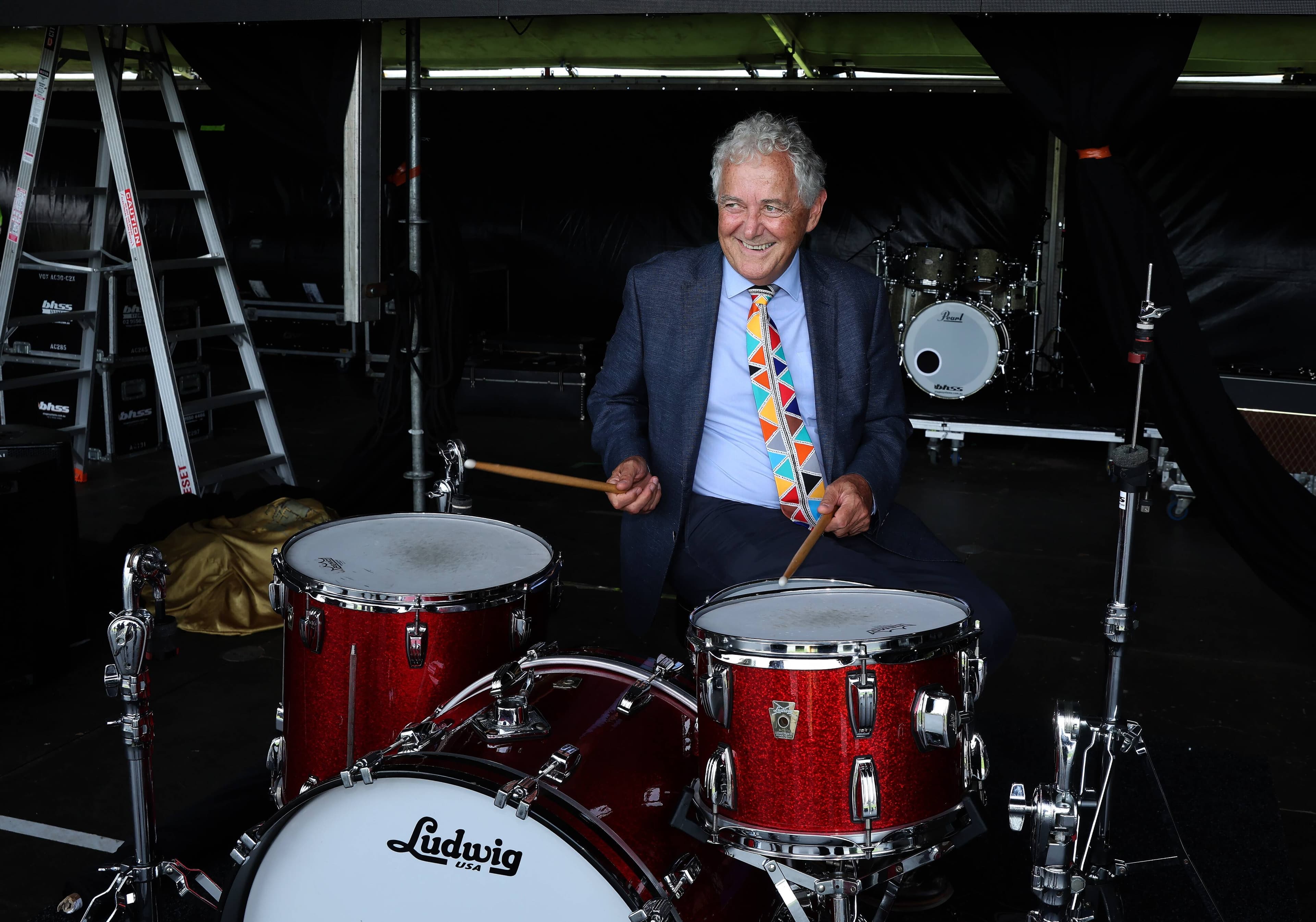 Newcastle Lord Mayor Ross Kerridge gives the drum kit a blast on stage in the lead up to Saturday's Howlin' Country Country Music Festival at Foreshore Park. Picture Peter Lorimer