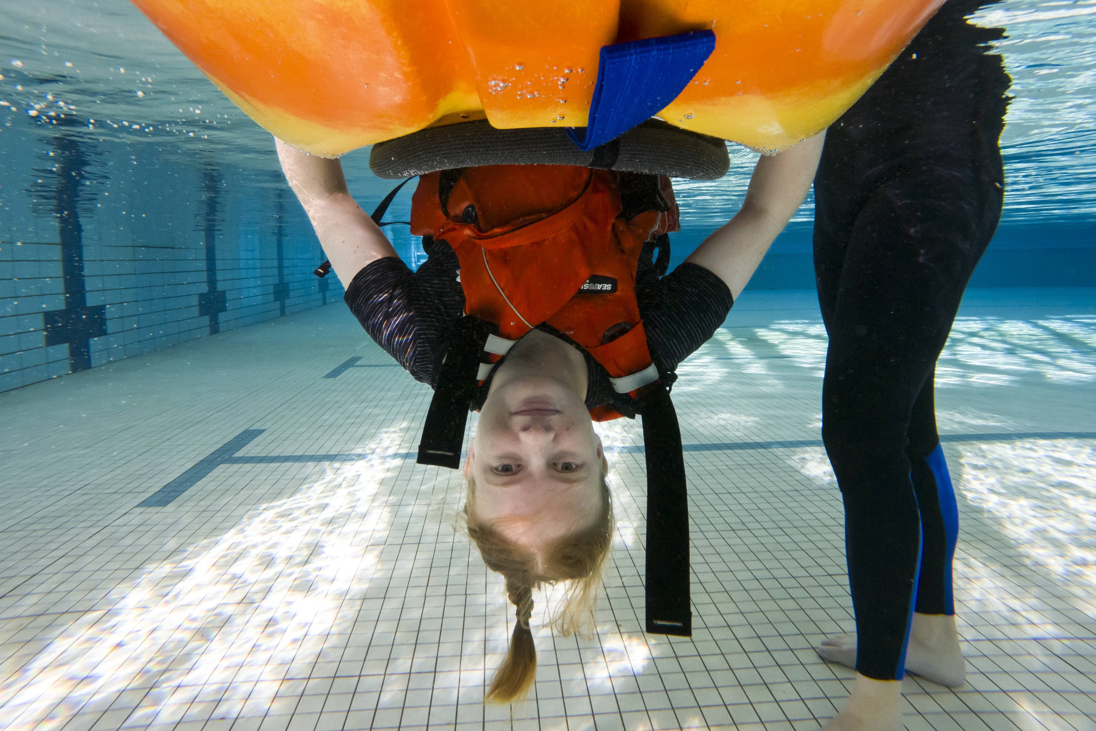 Army resilience training at the Army Logistic Training Centre (Latchford Barracks). Participants will feel the effects of honing stress management skills as they master their response to capsizing in a kayak, relying on drills, mates and themselves to get upright again. --- Lieutenant Keisha Dowsett with Human Factors Training Major James Brundish (trainer). Picture by Mark Jesser