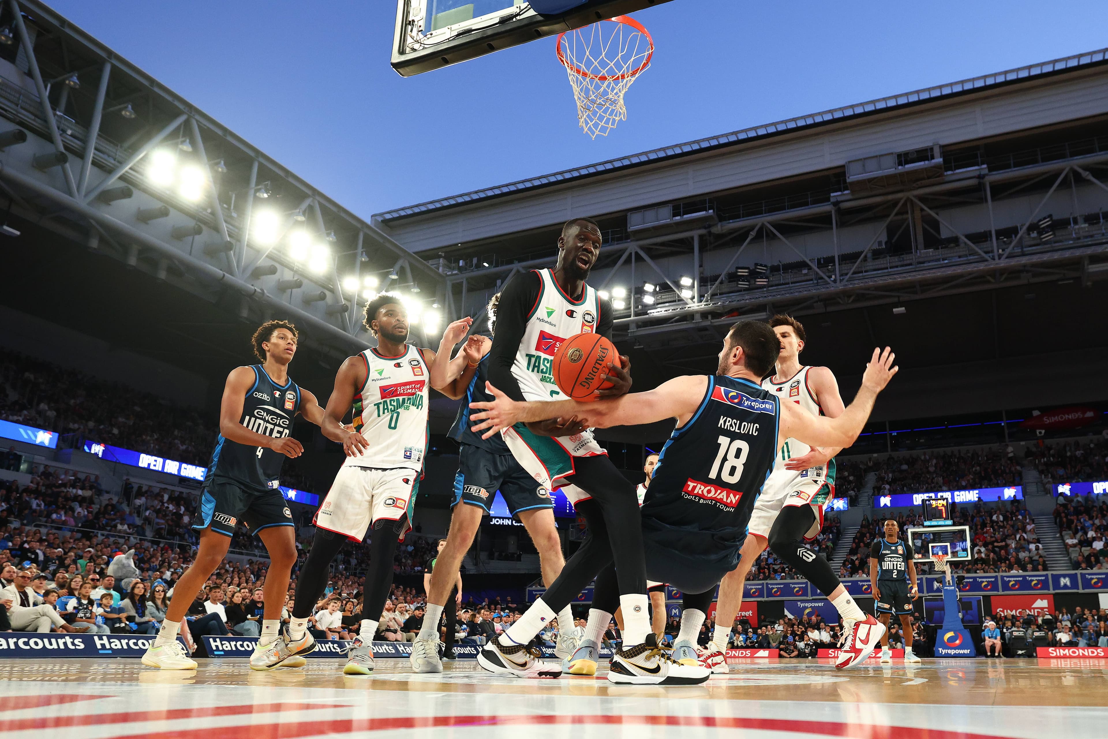 Tasmania JackJumper Majok Deng completes the block on Melbourne United's Fabijan Krslovic. Picture by Daniel Pockett/Getty Images