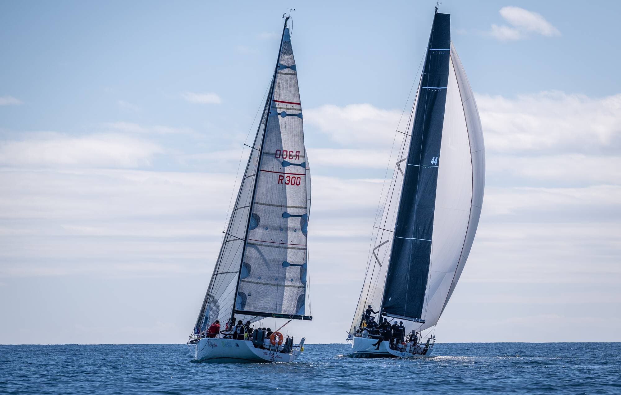 The Dog House and Tempo sailing off towards the horizon.