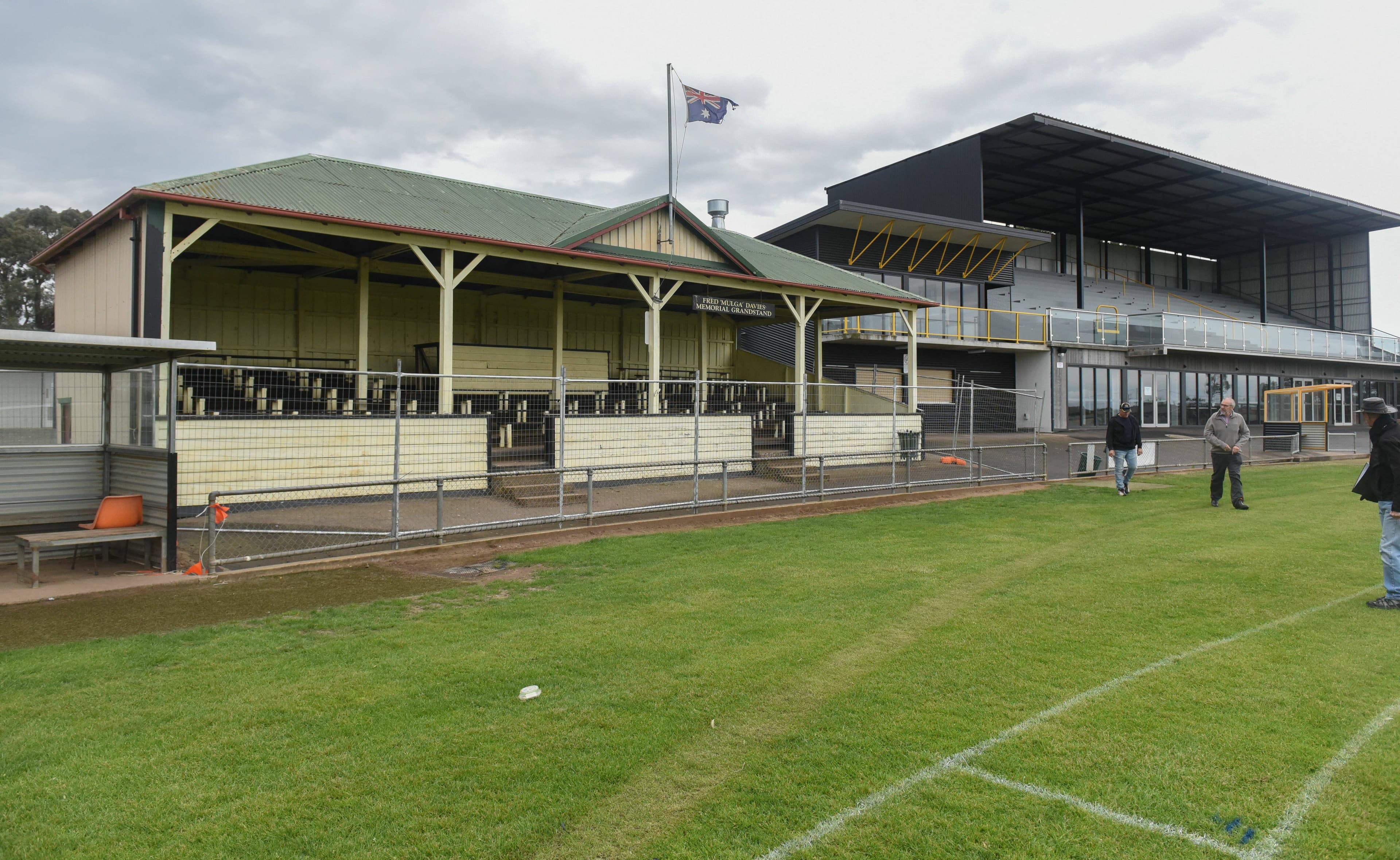 The old wooden stand in the foreground with the newer stand and clubrooms in the background. Picture by Craig George
