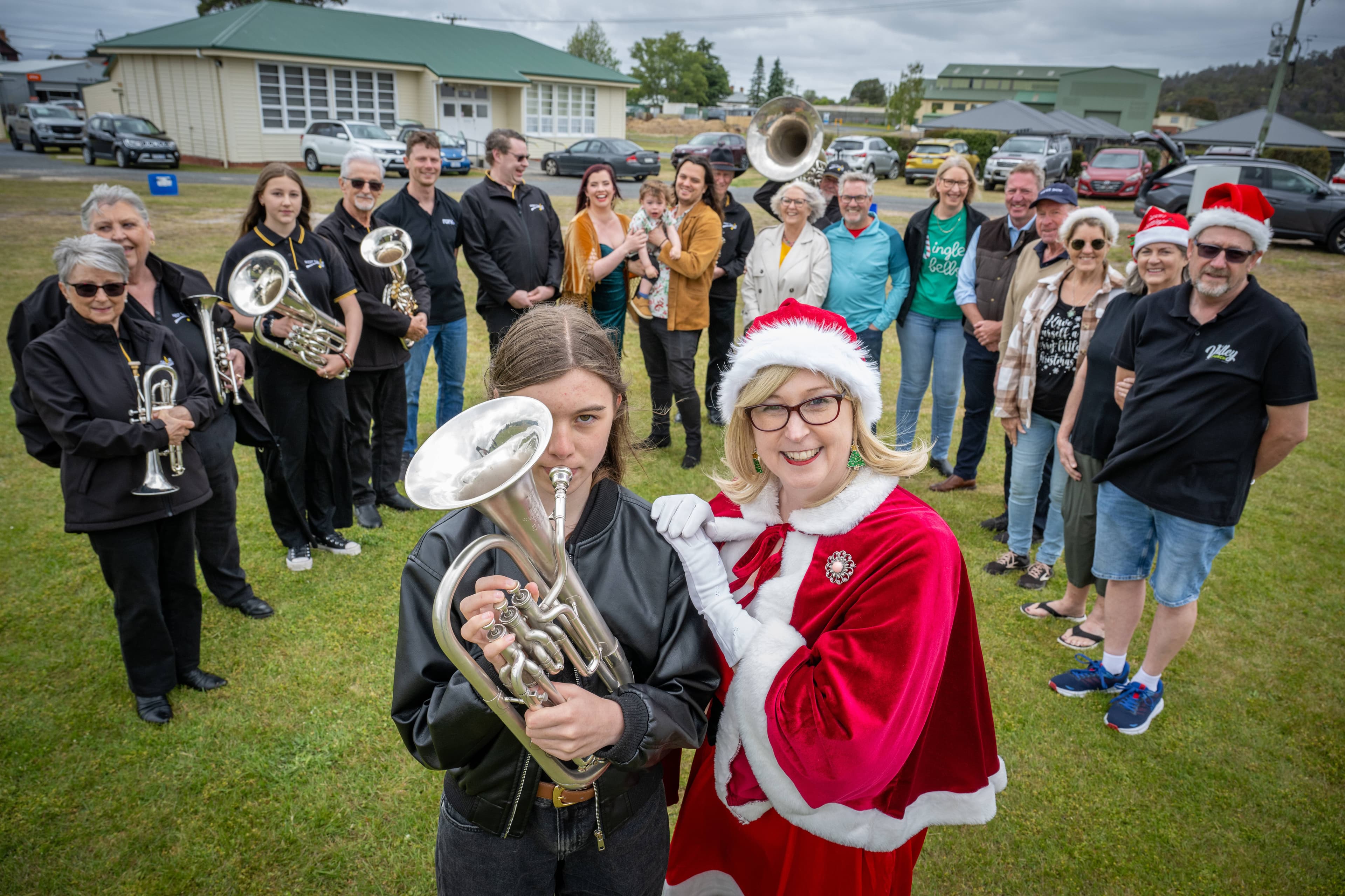 Ada Robinson, of the West Tamar Municipal Band, with Racheal Leigh and West Tamar Community Carols organisers and performers. Picture by Paul Scambler