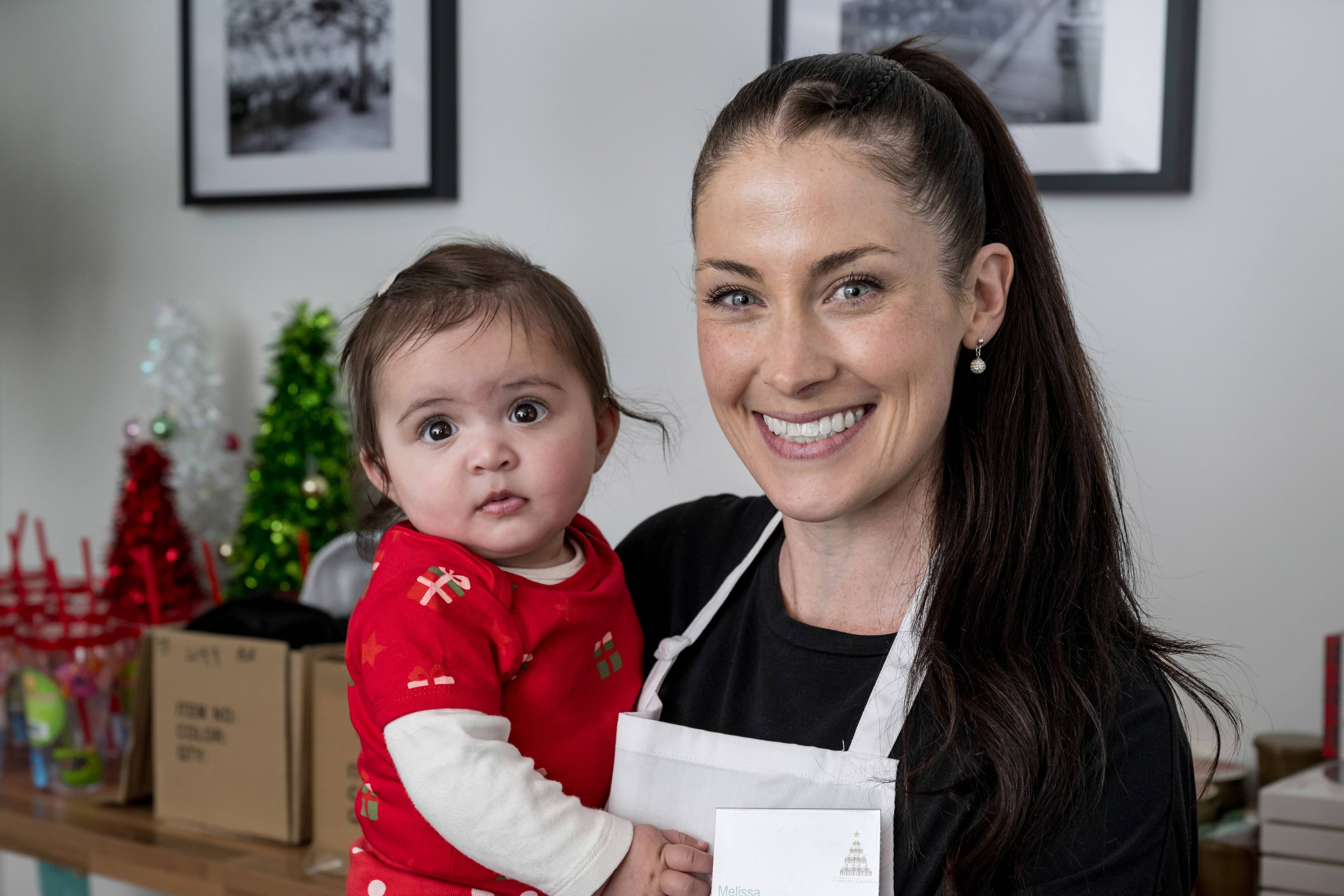 Volunteer Melissa Cripps with her daughter, Neave, at the Community Christmas Lunch. Picture by Phillip Biggs