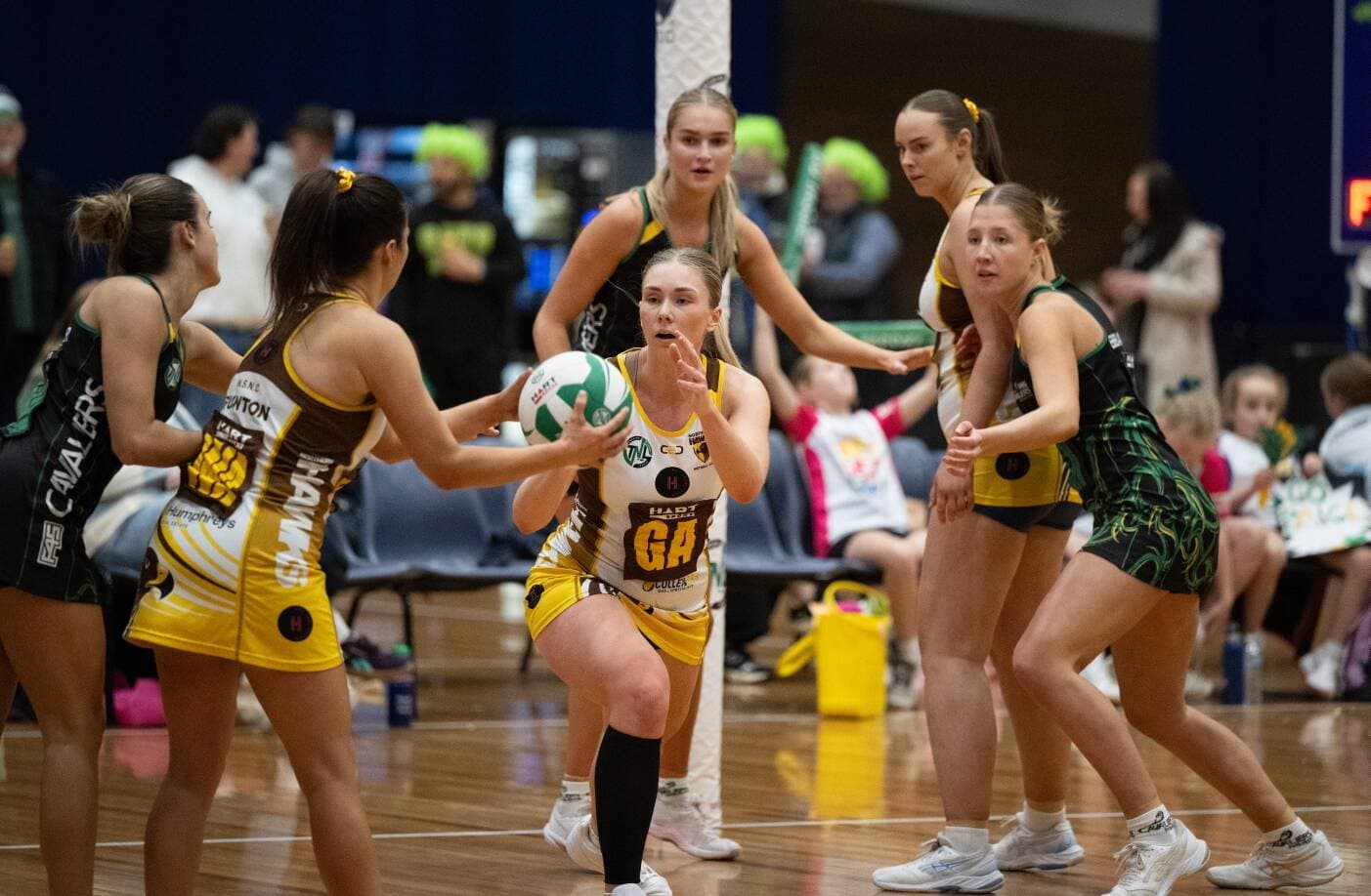 Cavaliers Ella McArthur, Paige O'Neill and Grace Ebbelaar, and Hawks Stephanie Gunton and GA Danielle Laugher during their Grand Final.