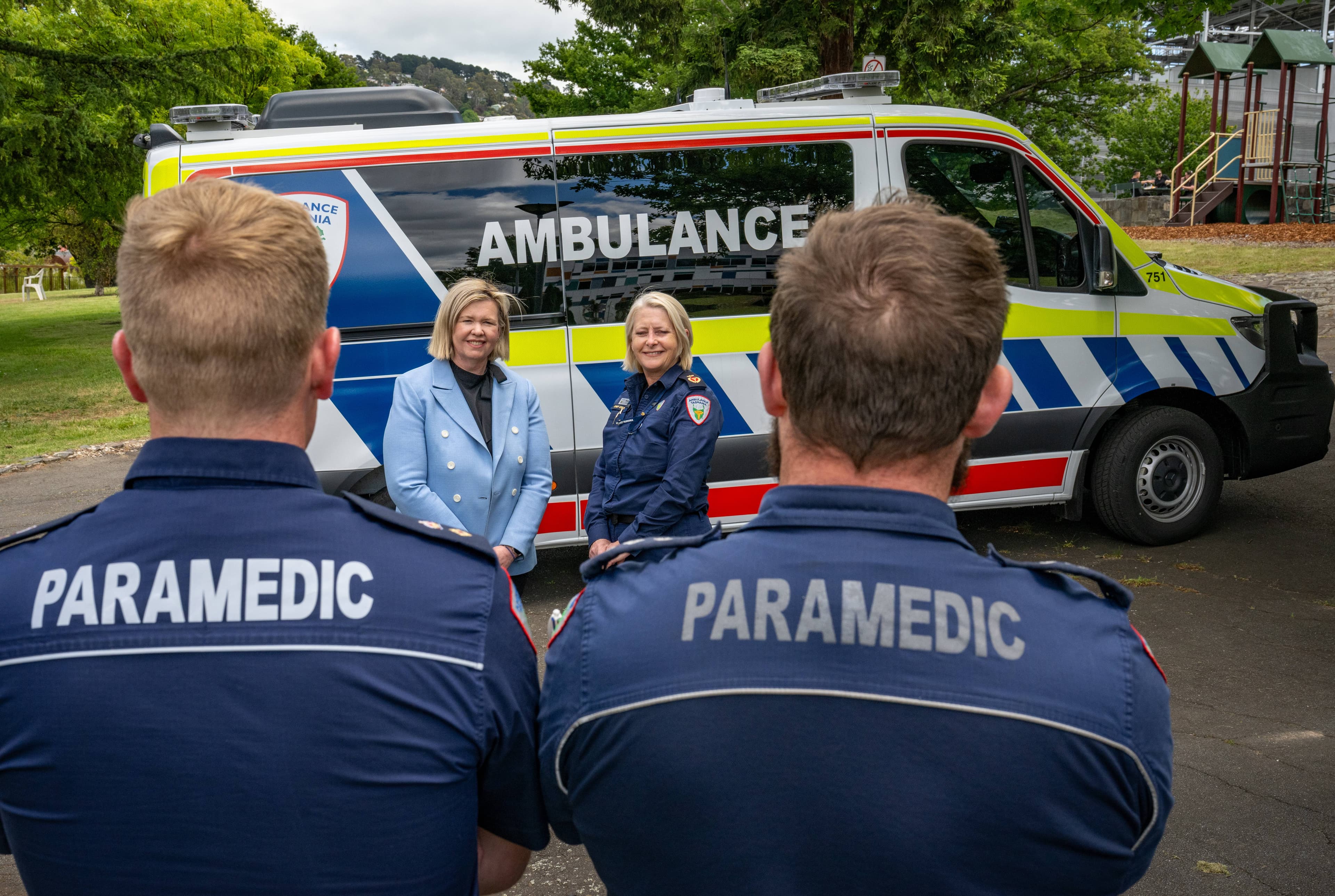 Bridget Archer, Minister for Health, and Michelle Baxter Interim Chief Executive Ambulance Tasmania, over the shoulder of Paramedics, Stefan Pitlo, Acting Operations Manager and Chris Strassmier, Acting operations supervisor