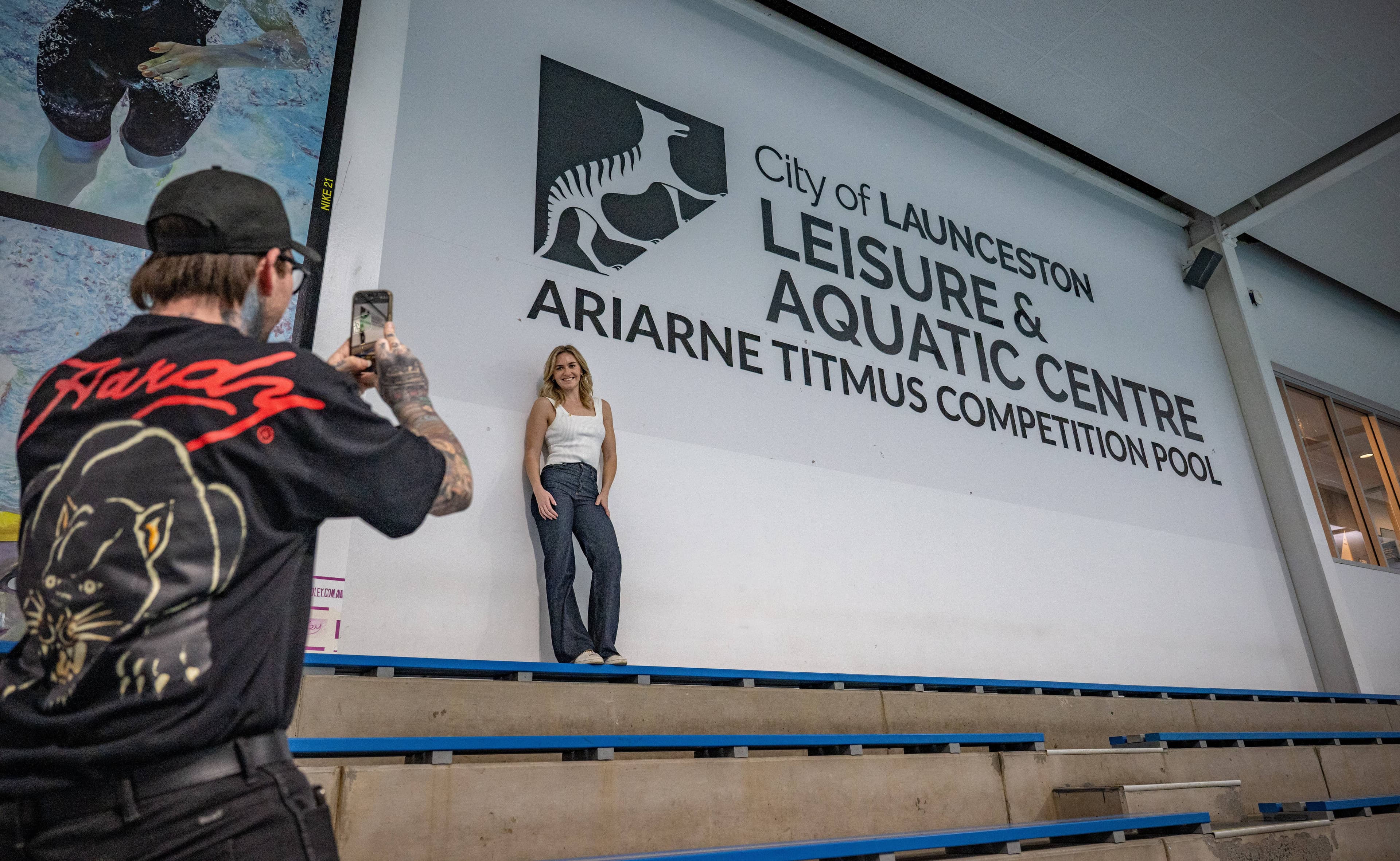 Ariarne Titmus has her photo taken by Mayor Matthew Garwood, on August 13, at the early morning Q and A session at Launceston Aquatic Centre.