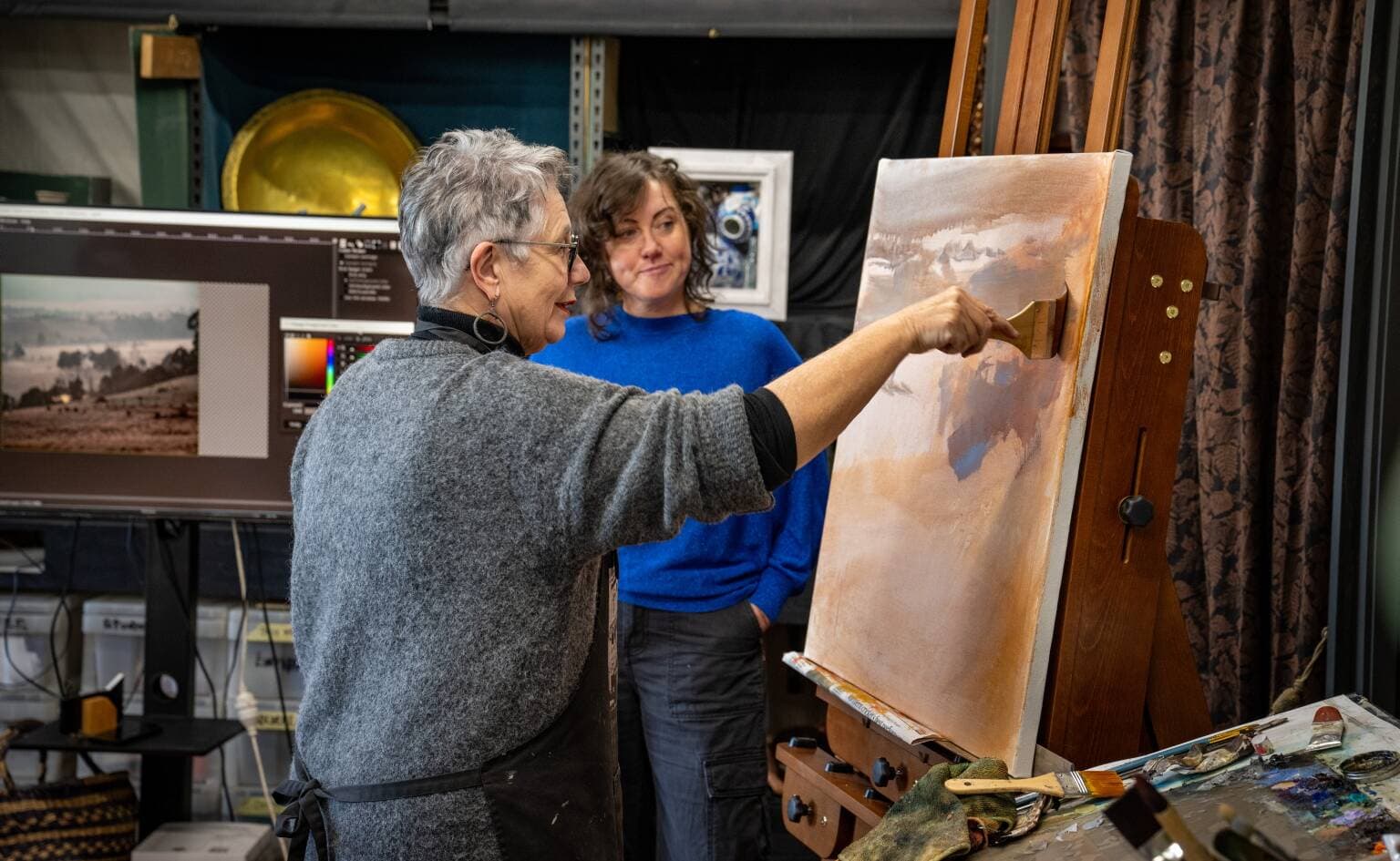 Artist Leoni Duff and her daughter Georgie Armstrong in Leoni's studio in Launceston.