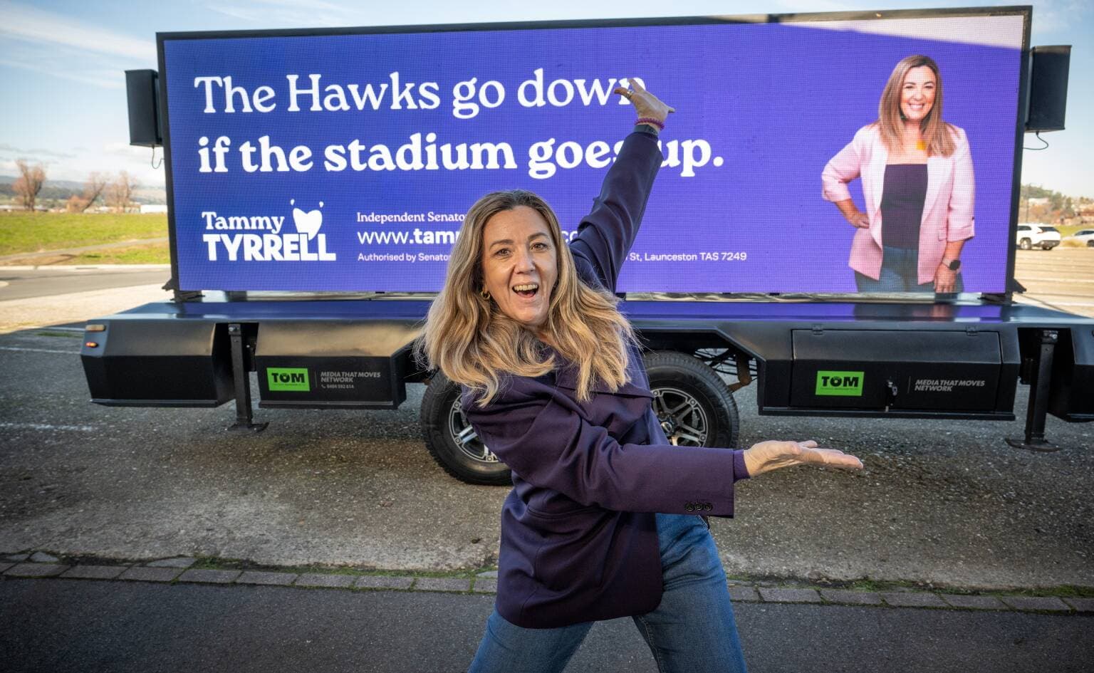 Senator Tammy Tyrrell in Inveresk, Launceston standing in front of her digital billboard on June 13.