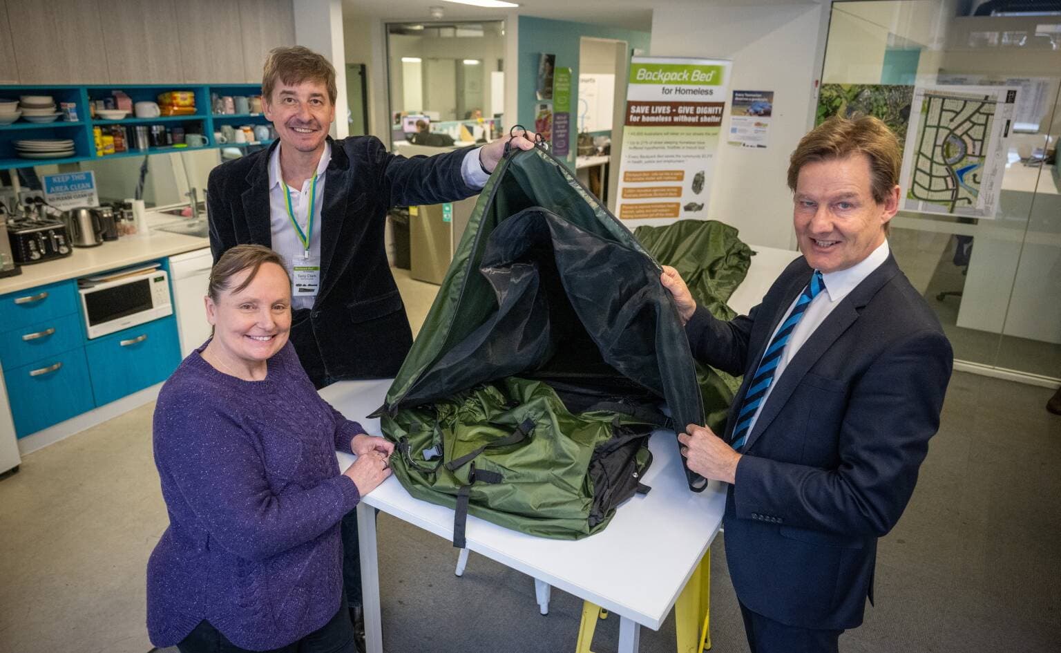 Louise Cowen of Shekinah House and Tony Morrison. Chief Executive Officer, Harcourts Tasmania with Tony Clark Founder & CEO of Backpack Bed for Homeless at Harcourts Launceston.