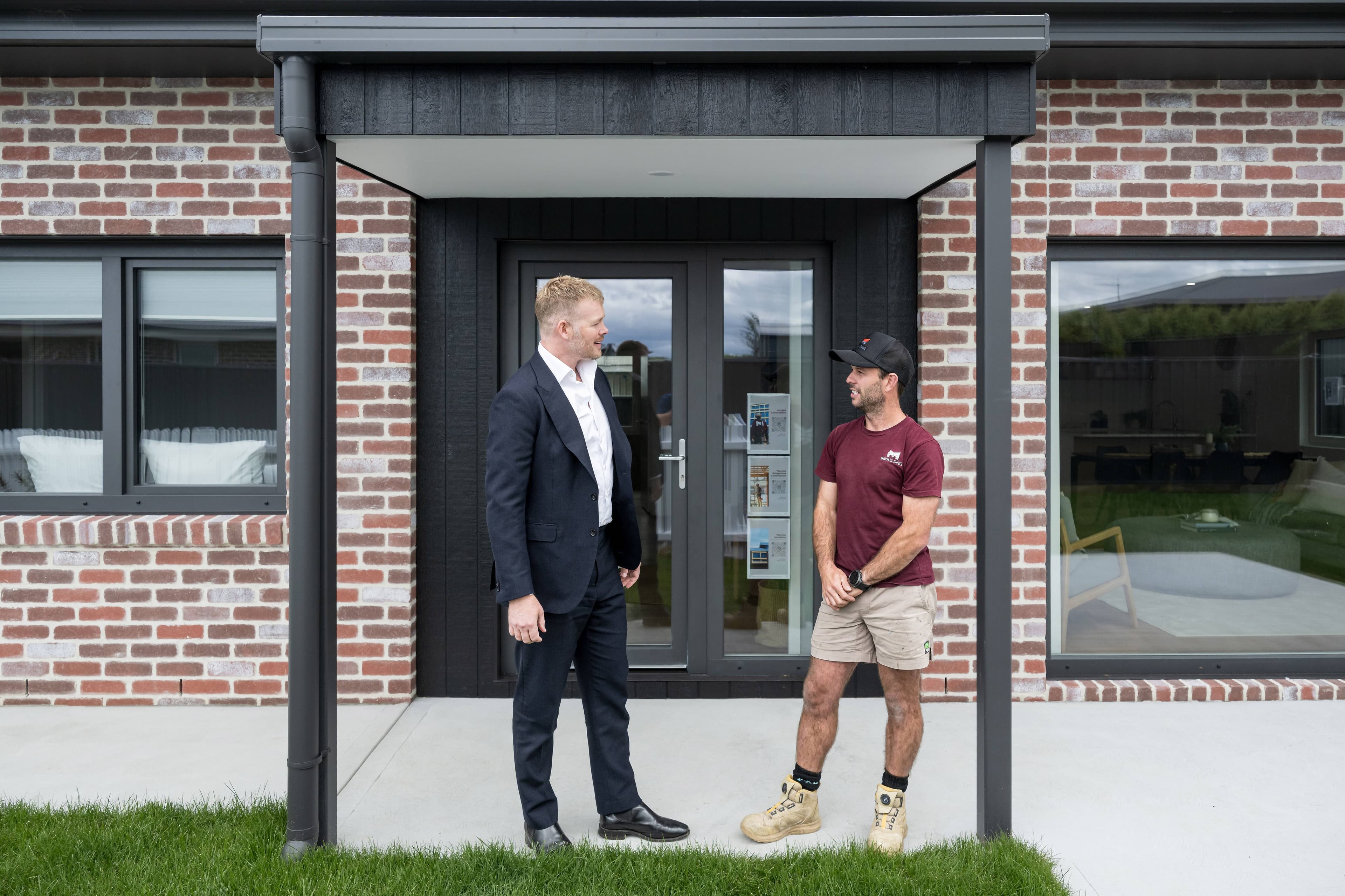 Builder Sam Mathew, of SM Building, with McGrath Launceston's Josh Hart. Picture by Phillip Biggs