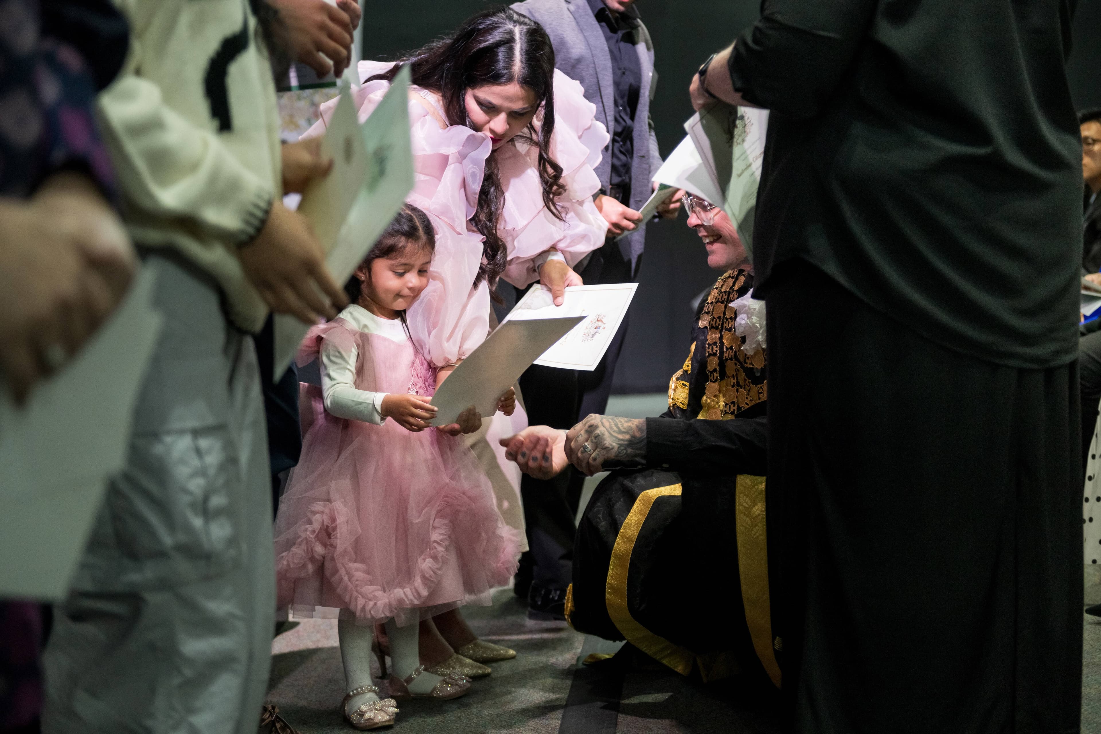 Launceston mayor Matthew Garwood welcomes new citizens at an Australain Citizenship ceremony at the Tramsheds, Launceston, on Friday, January 24, 2025.