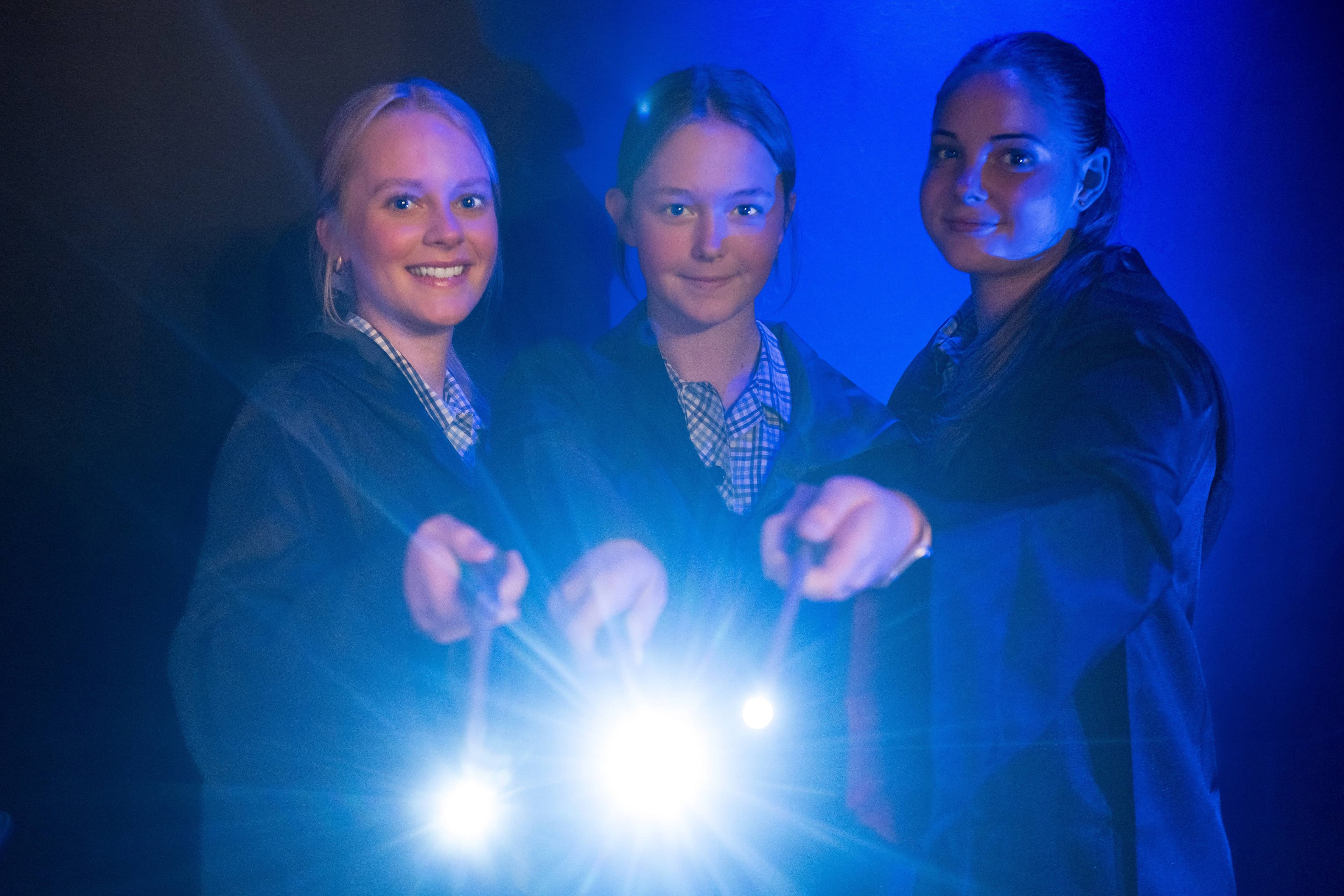 Eloise Breden, Eva Cetti and Erin Grubert promote the Scotch Oakburn College Tasmanian premiere of Harry Potter and the Cursed Child in April.