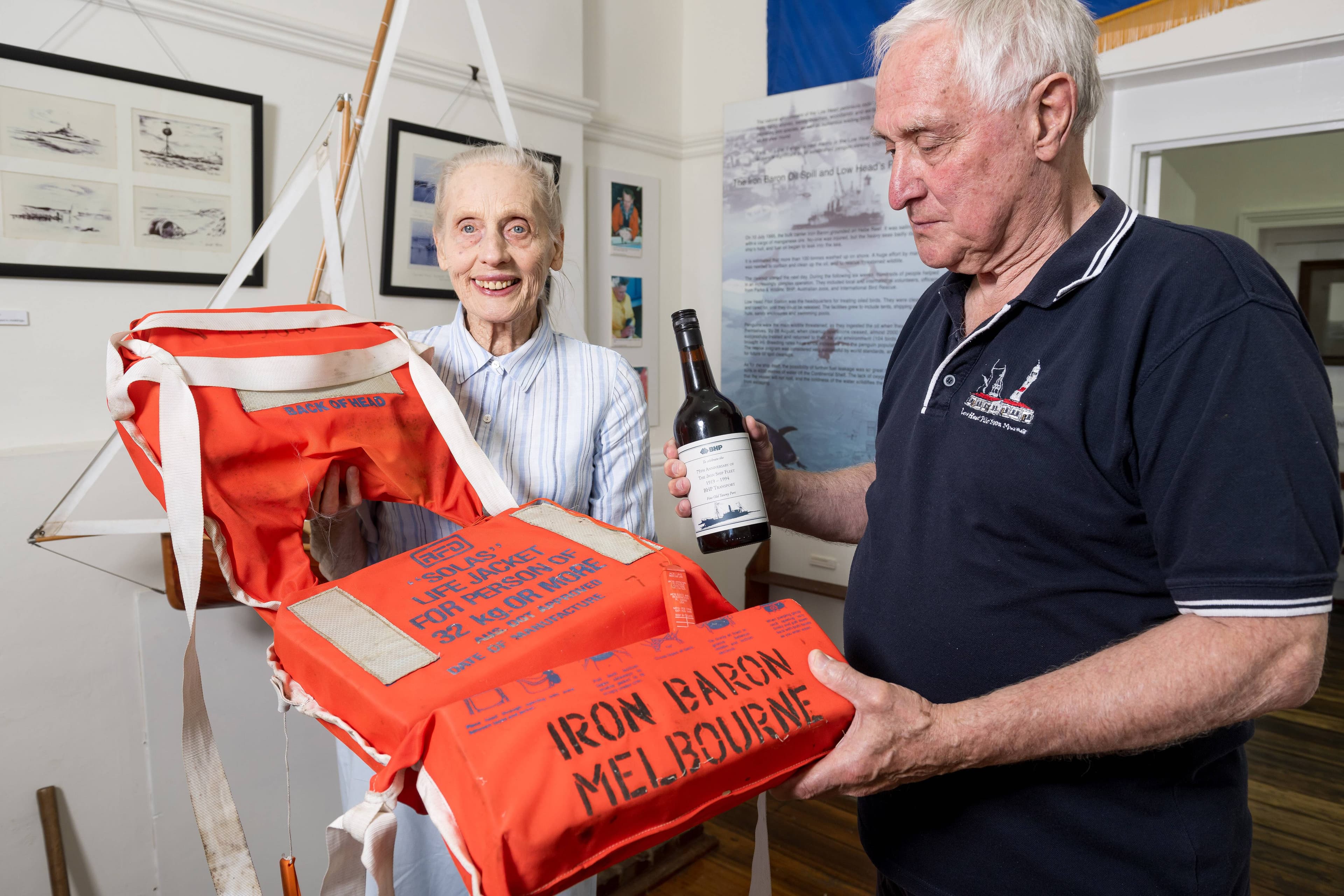 Doreen Shaw, of Low Head, has what she believes to be the last bottle of port saved from the shipwreck of the Iron Baron at Hebe Reef in the Bass Strait. She presented it to curator Des Wootton at the Low Head Maritime Museum in January.