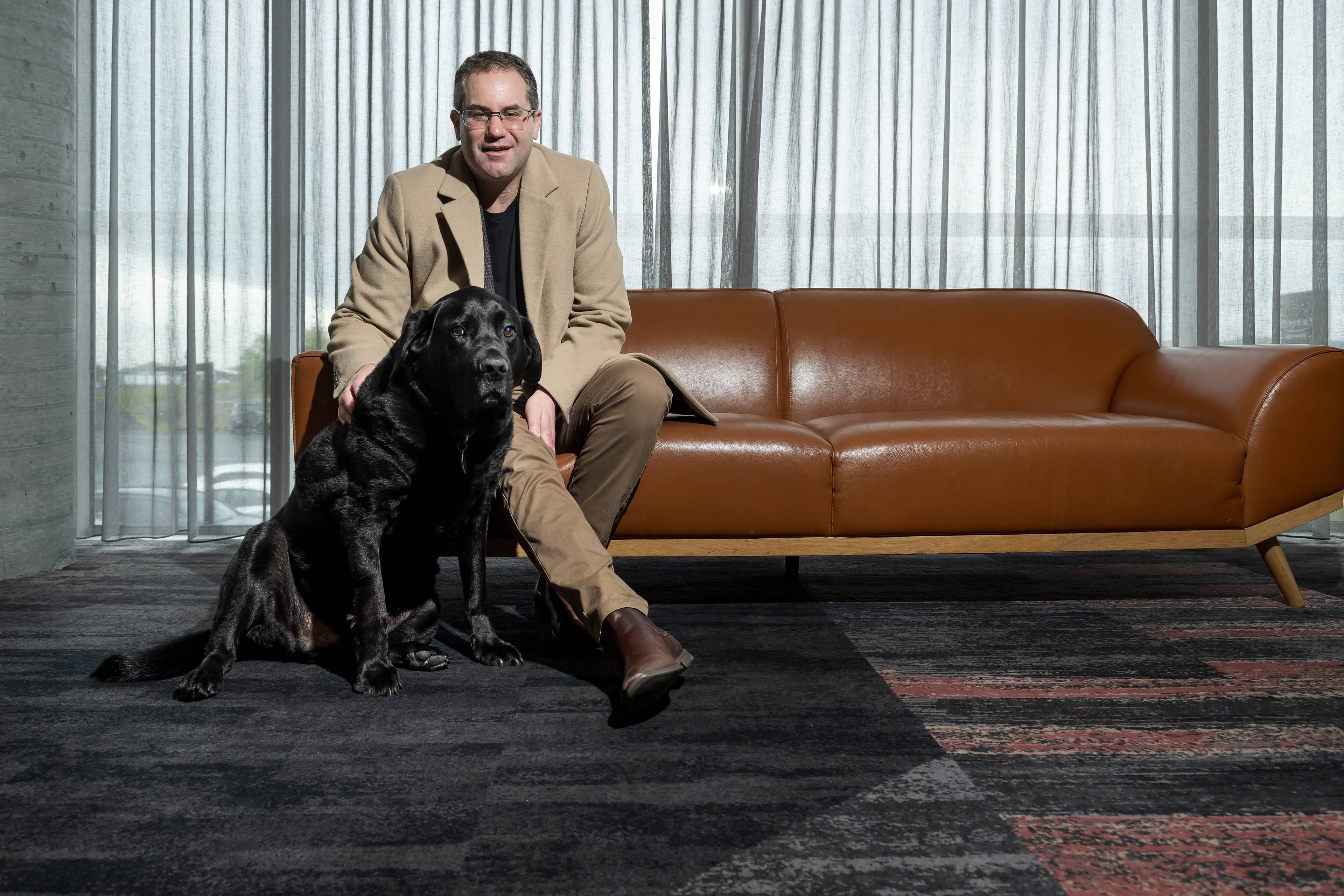 Archie the Silo Hotel dog is one of three dogs featured in a mini movie called Canine Concierge. Archie is pictured with Silo Hotel general manager Paul Seamen in July.